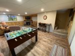 Lower Level Family Room with foosball, TV, fireplace